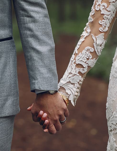 Amara and James holding hands